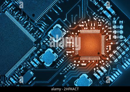 Processor on a printed circuit board. Abstract technological background. Tinted in two colors Stock Photo
