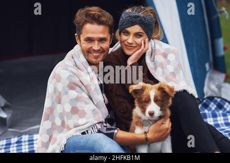 Young nice couple having fun on camping Stock Photo