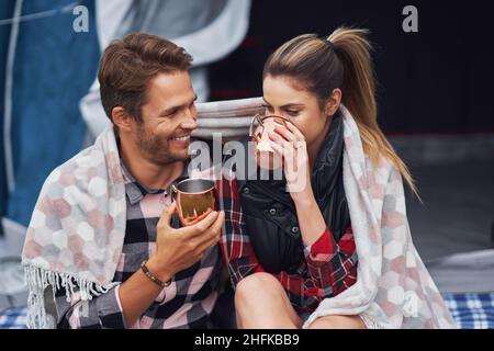 Young nice couple having fun on camping Stock Photo