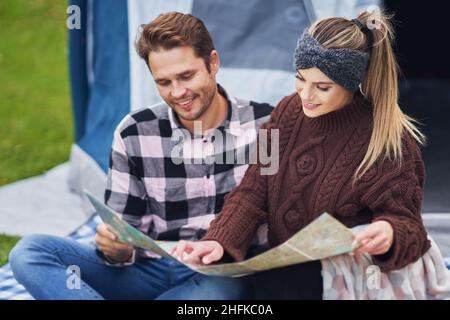 Young nice couple having fun on camping Stock Photo