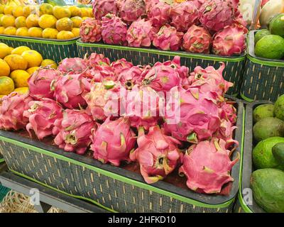 fresh red dragon fruit on the supermarket shelf. Stock Photo