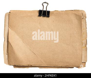 Old used paper sheets with metal clip isolated on white background Stock Photo