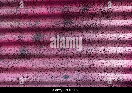 Weathered and distressed painted corrugated metal background Stock Photo