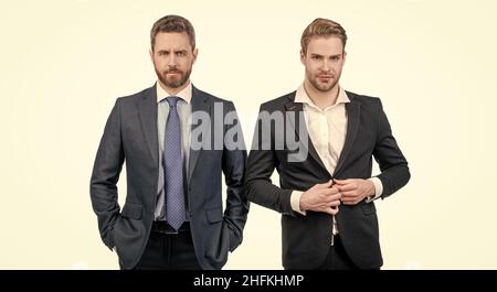 two confident men businessmen in formal suit are business partners isolated on white, leadership Stock Photo