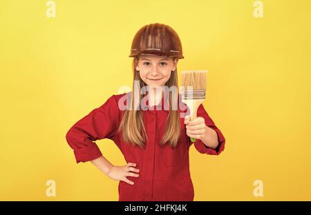 future renovator. improvement. making surface repair. happy teen girl hold painting brush. Stock Photo