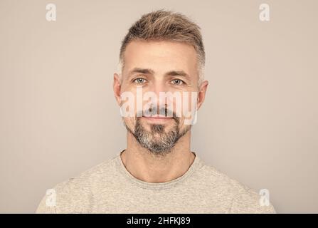 mature handsome man portrait with grizzled beard hair, male beauty Stock Photo