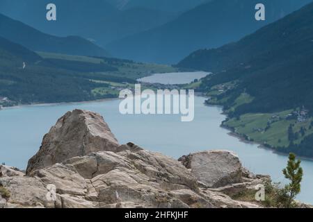 A well-known viewpoint in the border region between Austria Tyrol and Italy Sydtirol at the Reschenpass with a fantastic view over the Reschensee and Stock Photo