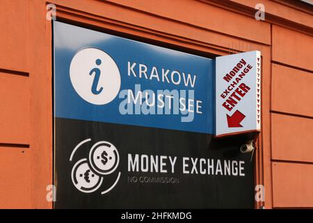 Cracow. Krakow. Poland. Currency exchange shop and tourist information office signboards on the facade. Stock Photo