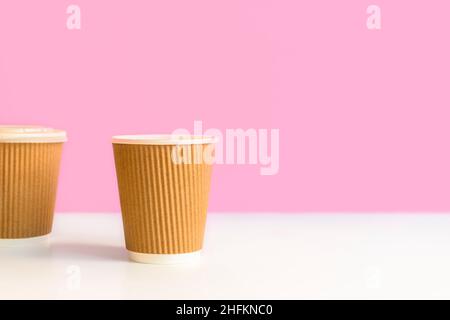 Reusable coffee cups on light pastel background with copy space. Eco-friendly concept Stock Photo