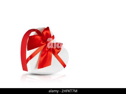Gift box in the shape of a heart on a isolated white background. Stock Photo