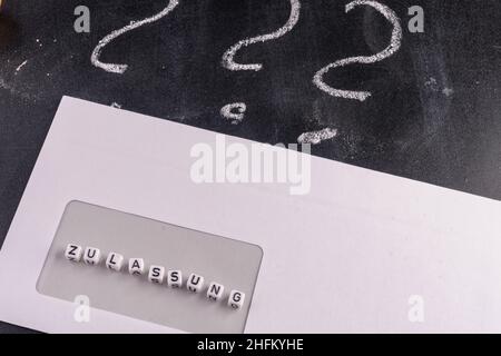 Question mark on blackboard with envelope Stock Photo