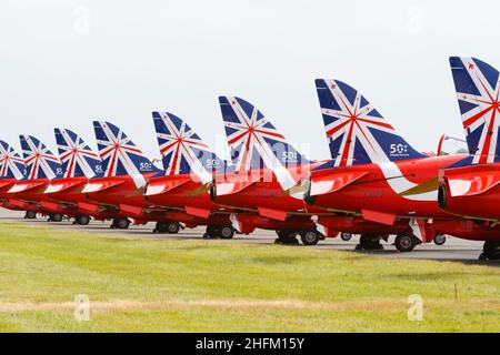 Line up of BAE Hawk T1a aircraft of the Royal Air Force aerobatic display team, The Red Arrows, with the 50th Anniversity tail markings. . RAF Wadding Stock Photo