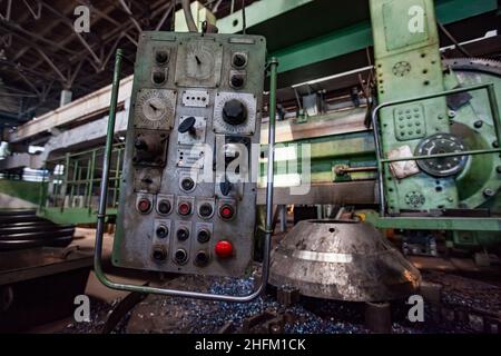 Ust'-Kamenogorsk, Kazakhstan-May 31,2012: Vostokmashzavod  heavy engineering plant. Control panel of giant vintage horizontal lathe (left). Stock Photo