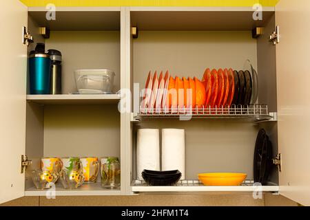 kitchen utensils and utensils are on the shelf of the kitchen cabinet. High quality photo Stock Photo