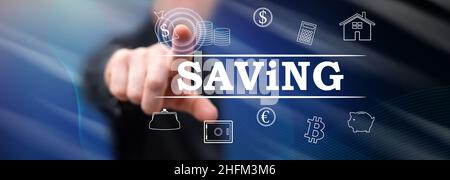 Man touching a saving concept on a touch screen with his finger Stock Photo