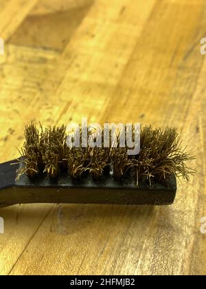 Used Brass Wire brush close up of the head . High quality photo Stock Photo