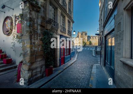 Paris, France - April 3, 2021: Small cosy street with City Hall in background in Paris Stock Photo