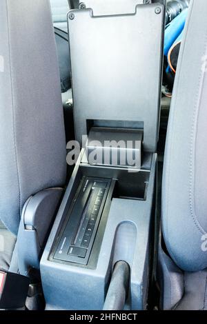 Car armrest with built in navigation system. Handbrake and armrest with CD player. Stock Photo