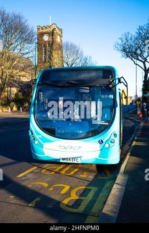 An Arriva bus working in Marske by the sea with a Covid safety mask painted on the front Stock Photo