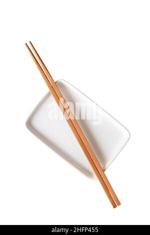 Empty ceramic rectangular plate with chopsticks isolated on white background Stock Photo