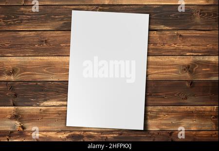 White Paper sheet  isolated on  white background on  wood background Stock Photo