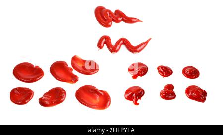Red sauce splashes isolated on white background. Ketchup. Stock Photo