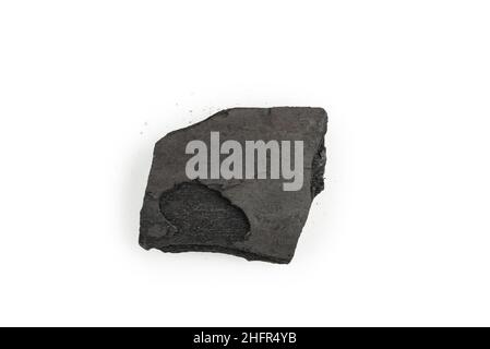 Black oak coal isolated on a white background. Stock Photo