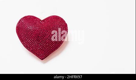 Heart isolated on white. Red color ruby shiny heart shape jewel. Marriage anniversary, Love symbol, design element. Stock Photo