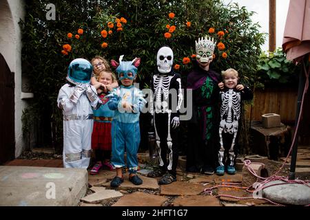 Group of Children in Costume Posing for Halloween in San Diego Stock Photo