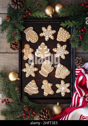 Overhead shot of a group of items for baking Christmas Cookies surrounding  an empty cookie sheet. Horizontal format on a rustic Stock Photo - Alamy