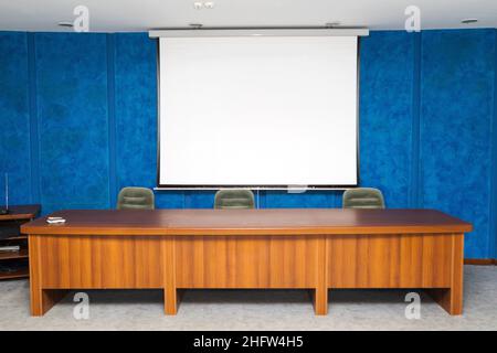 Empty, clean the screen to show the images in a small, cozy meeting room, as background for design Stock Photo