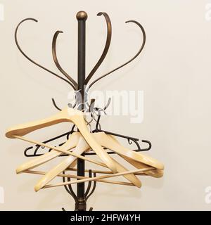Empty hangers for clothes hanging on a metal stand curly Stock Photo