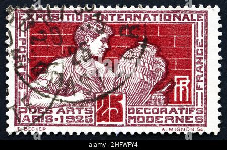FRANCE - CIRCA 1924: a stamp printed in the France shows Potter Decorating Vase, International Exhibition of Decorative Modern Arts at Paris, 1925, ci Stock Photo