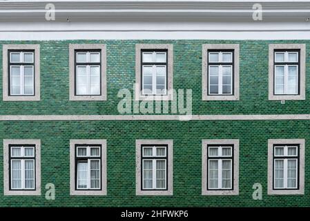 Architectural detail close-up of traditional green tile wall facade of apartment building in Lisbon Portugal Stock Photo