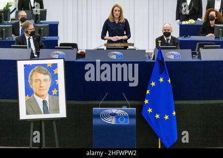 17 January 2022, France, Straßburg: Roberta Metsola, executive president of the European Parliament and member of the Partit Nazzjonalista (PN) party, stands in the European Parliament building while a picture of late President David Sassoli is seen in the foreground. Members of the European Parliament and other political companions remember the late former EU Parliament President Sassoli in a memorial ceremony. Sassoli passed away in Italy earlier this year. Photo: Philipp von Ditfurth/dpa Stock Photo