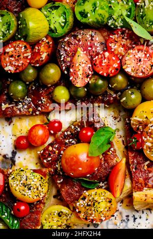 Cheese tomato and pesto  tart.style rustic.selective focus Stock Photo