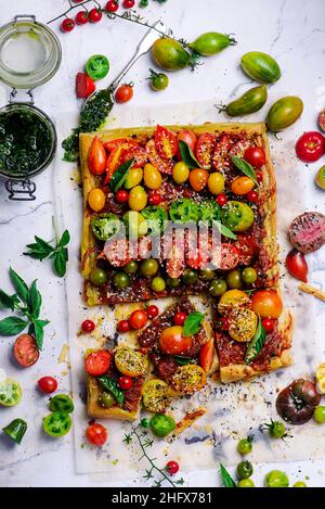 Cheese tomato and pesto  tart.style rustic.selective focus Stock Photo