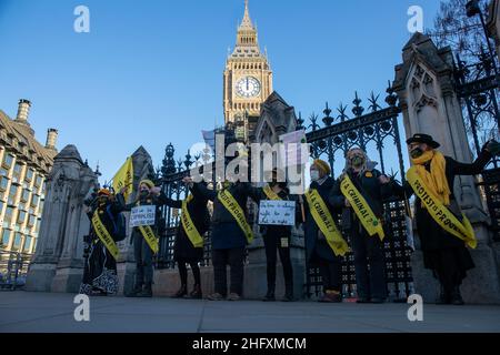 LONDON, UK 17th January 2022. Women's and FINT Kill The Bill Protest dressed as suffragettes on College Green as the House of Lords votes on the Police, Crime, Sentencing and Courts Bill
