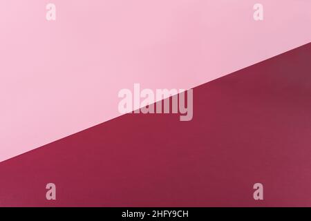 Double paper backdrop, floor and wall, pink and red wine colors, at an angle Stock Photo