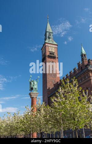 Copenhagen, Denmark - May 12 2017:  The Horn Blowers statue and clock tower at Rådhuspladsen.. Stock Photo