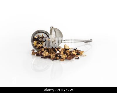 Dry loose tea hibiscus on a white background Studio Photo, macro, many details, tea strainer Stock Photo