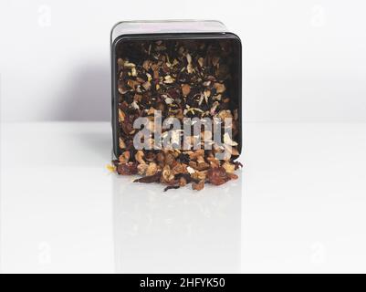 Dry powdered hibiscus tea on a white background Studio Photo, macro, many details, tea box Stock Photo