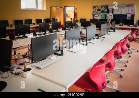 many computers are in the computer cabinet in a school Stock Photo