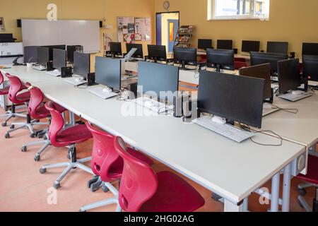 many computers are in the computer cabinet in a school Stock Photo