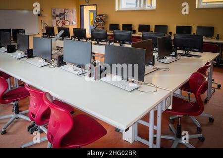 many computers are in the computer cabinet in a school Stock Photo