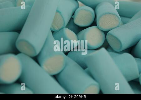 chewable marmalade blue sticks with white middle croup plan. dessert. Food day sweets. Stock Photo