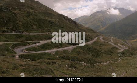 Serpentine road leading up to the Furka Pass in Grisons, Switzerland Stock Photo