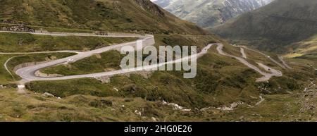 Serpentine road leading up to the Furka Pass in Grisons, Switzerland Stock Photo