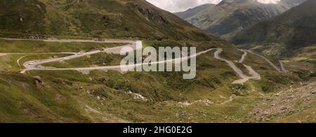 Serpentine road leading up to the Furka Pass in Grisons, Switzerland Stock Photo