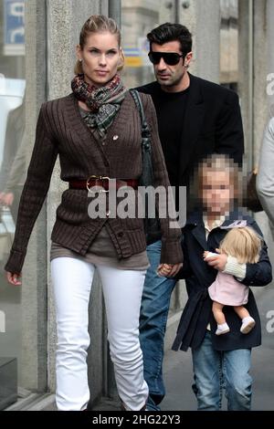 Luis Figo with daughter and wife Helen Svedin shopping in Milan. Stock Photo